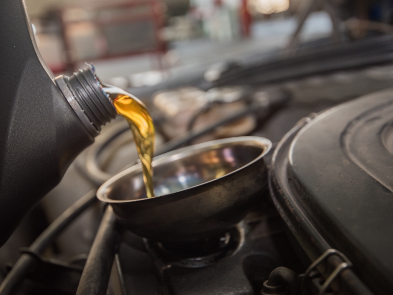 New engine oil being added to a vehicle
