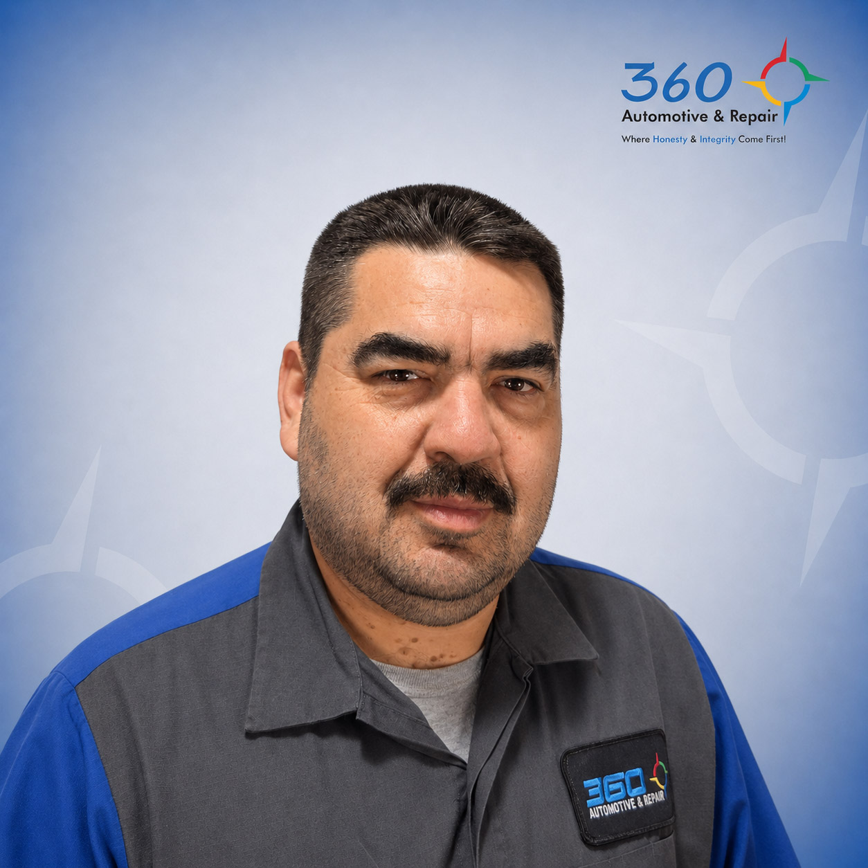 Automotive technician portrait in branded uniform