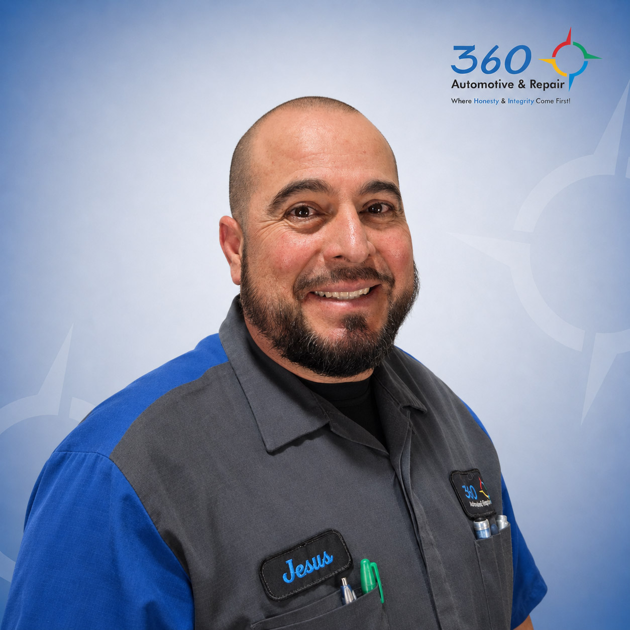 Smiling auto technician in uniform portrait