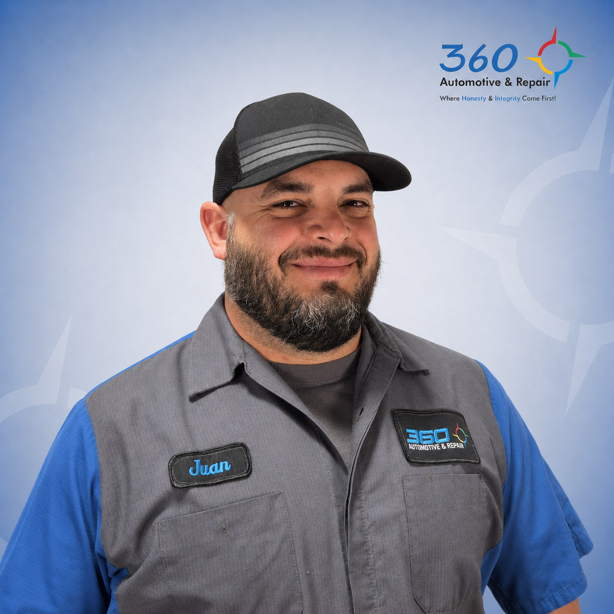 Auto technician Juan in shop uniform portrait