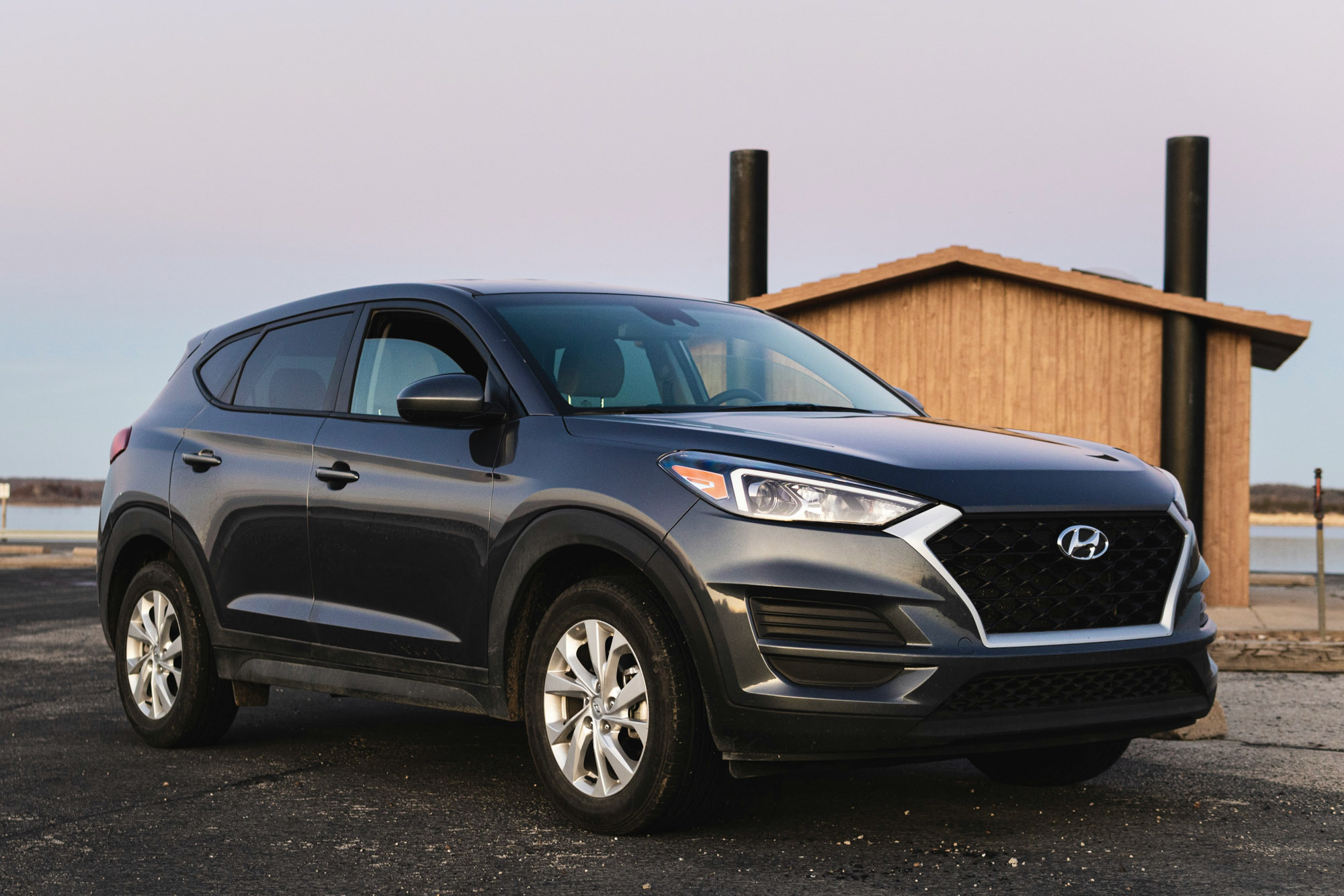 Gray Hyundai SUV parked near waterfront building